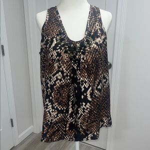 Silk sleeveless pleated blouse with jeweled neckline